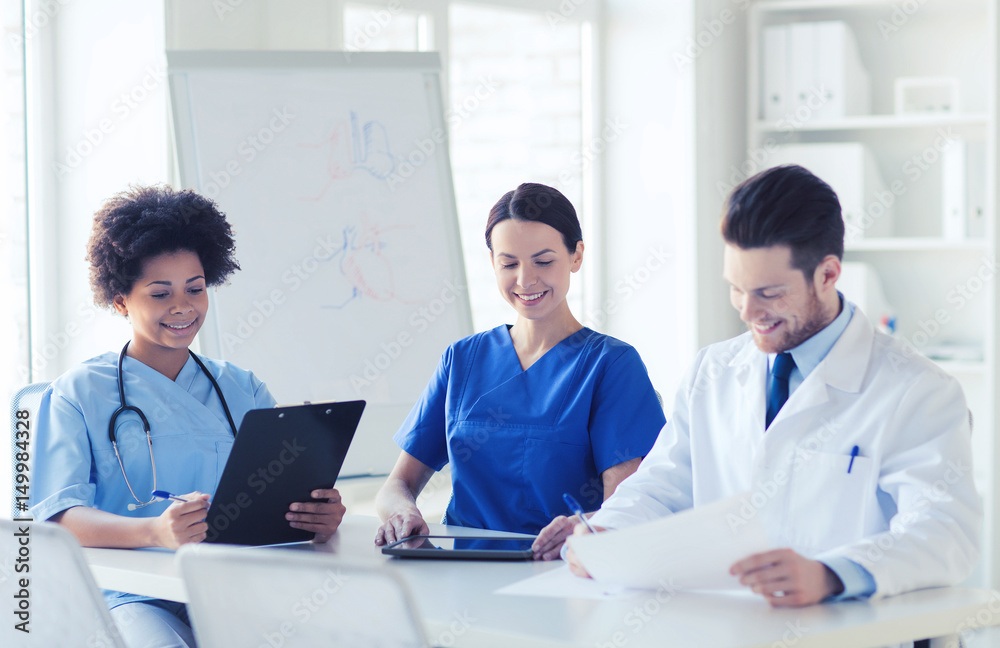 group of happy doctors meeting at hospital office group of happy doctors meeting at hospital office