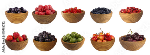 different berries isolated on white background. Collage of fruits and berries  blueberry  blackberry  cherry  strawberry  currant and raspberry. Collection of fruits and berries in a bowl.