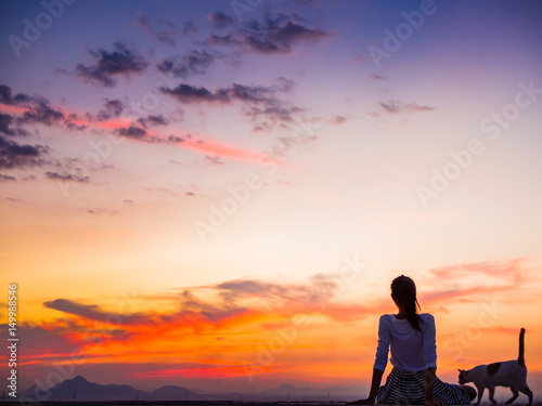 Silhouette of free woman enjoying freedom feeling happy at sunset. relaxing woman in pure happiness © max_play