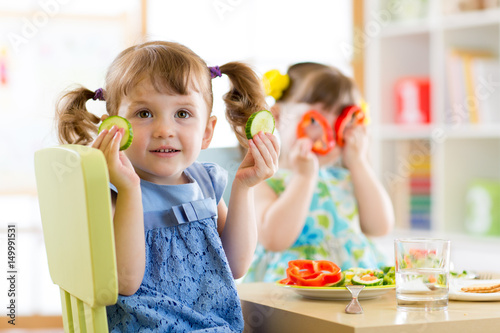 kids eating healthy food in...