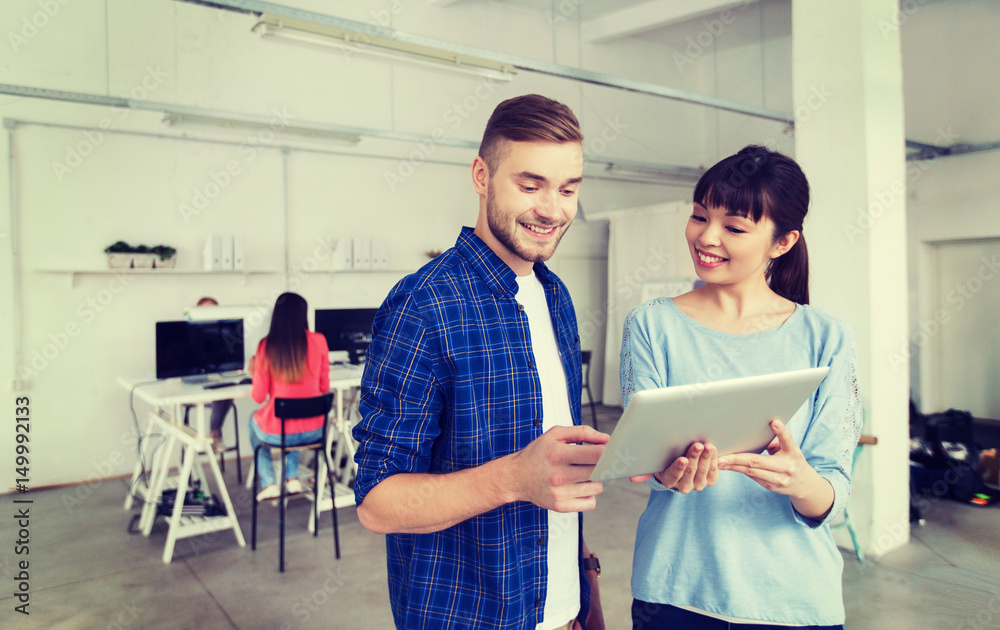 Obraz premium couple with smartphone and tablet pc at office