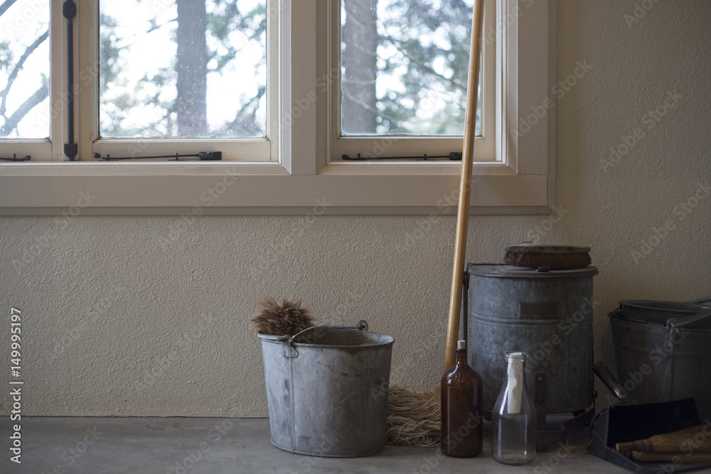 Hollow Disclose Weird Antique Farm Style Cleaning Supplies Galvanized Buckets, Mops, Dust Pan,  Scrub Brush, Wisk Brooms, Feather Duster Bottles, Windows in Background  White Walls, Cement Floor, Daytime (HDR Image) Stock Photo | Adobe Stock