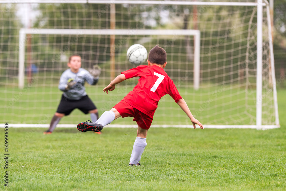 Kids soccer football - children players match on soccer field