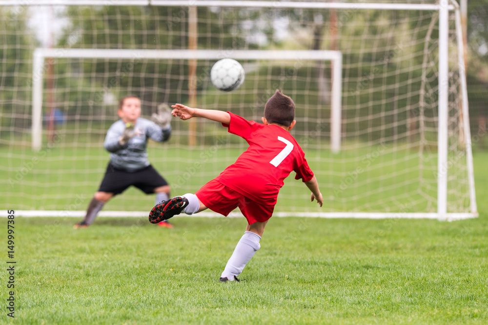 Kids soccer football - children players match on soccer field Kids soccer football - children players match on soccer field