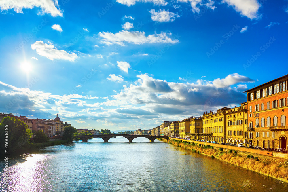 Santa Trinita Bridge on Arno river, sunset landscape. Florence, Italy