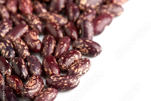 Dark Spotted kidney bean isolated on white background. Dark kidney bean texture background. A large bean with a subtle sweet flavor and soft texture. Beans. Proper nutrition. Vitamins. Healthy food. © stas_malyarevsky