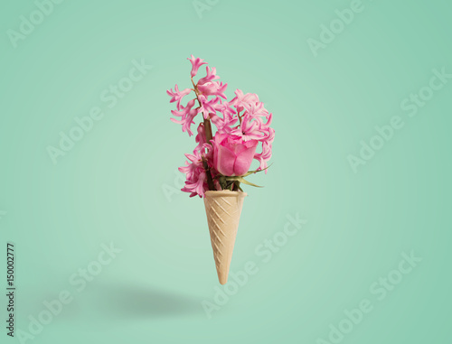 Fototapeta Naklejka Na Ścianę i Meble -  Flowers in a waffle cone on white background