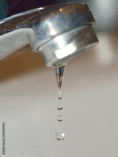 Close up of dripping faucet