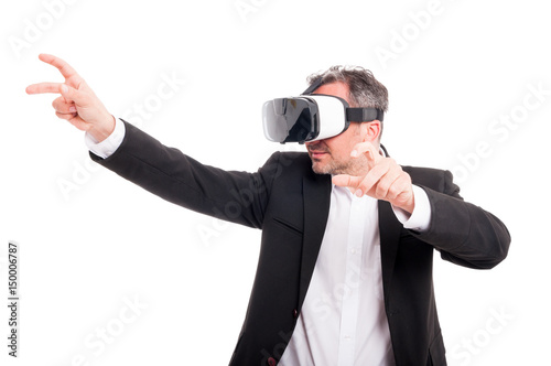 Modern male enjoying virtual reality thru futuristic headset