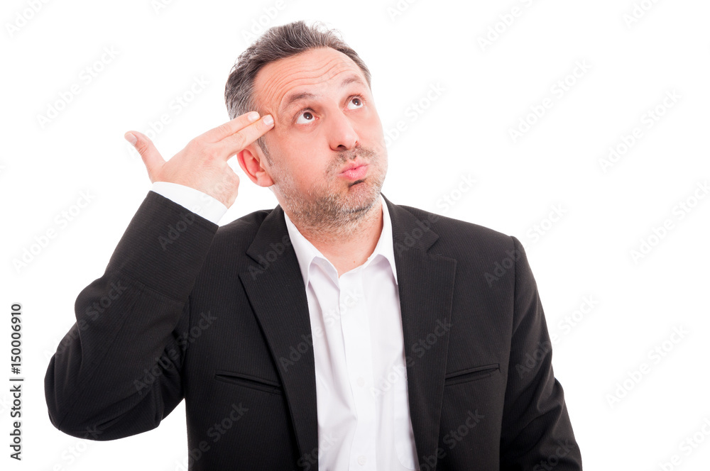 Portrait of young man pretending to shoot himself Portrait of young man pretending to shoot himself