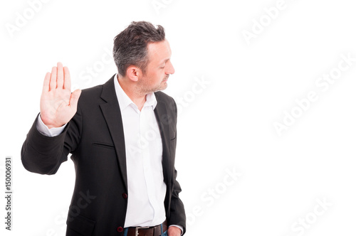Young male rising up one hand
