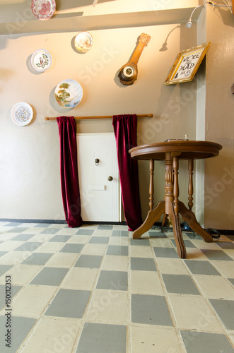 playroom,small door behind curtain, inspired from Alice in Wonderland famous scene. Novel, by an English author Lewis Carroll, was reproduced as movies & animations