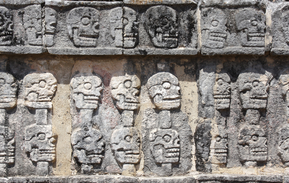 Bas-relief carving with human skulls on Tzompantli , Chichen Itza, Yucatan, Mexico