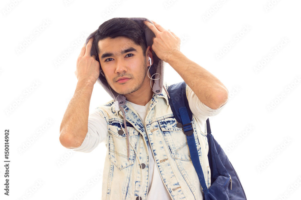 Young man with backpack and headphones Young man with backpack and headphones