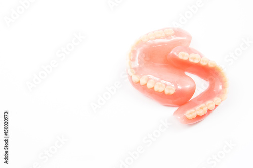 complte denture on white background