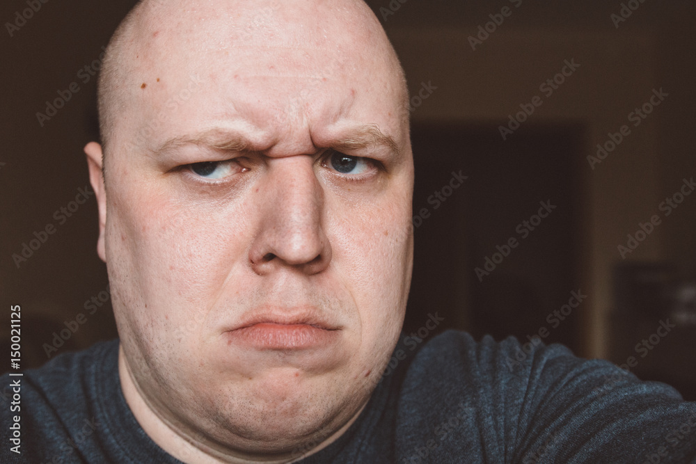 Obraz premium Scary expression with bulging eyes and bald head