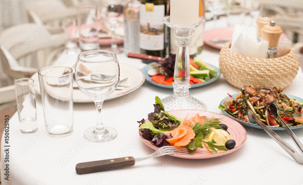 Festive table with snacks and flowers