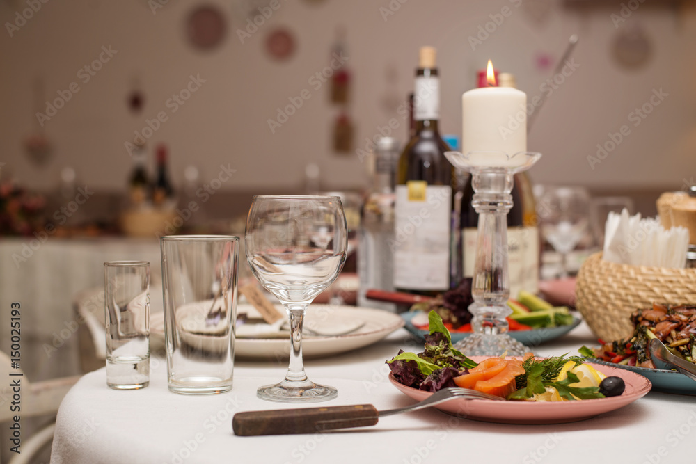 Festive table with snacks and flowers Festive table with snacks and flowers