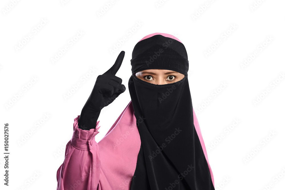 Close up asian muslim woman in hijab pointing with angry eyes Close up asian muslim woman in hijab pointing with angry eyes