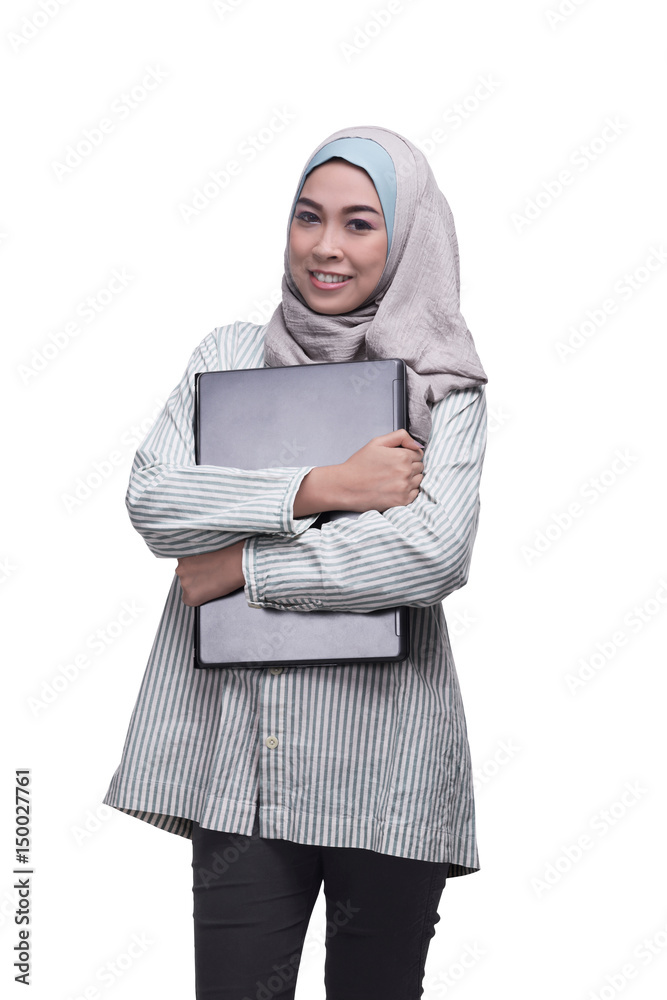 Smiling asian muslim woman with laptop