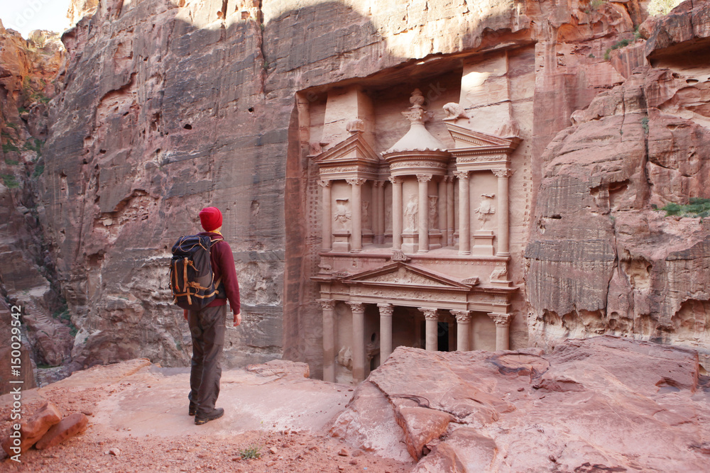 Petra, Traveler looking at the Treasury. Jordan. 
