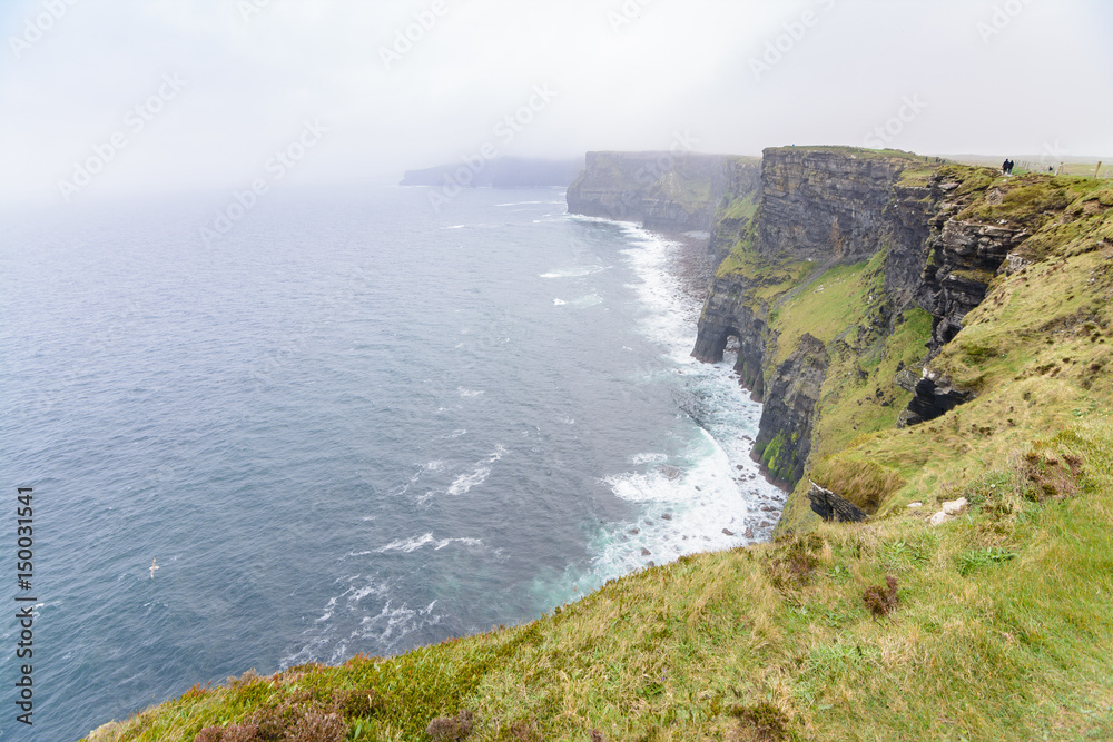 amazing cliffs of Moher on foggy day, Ireland