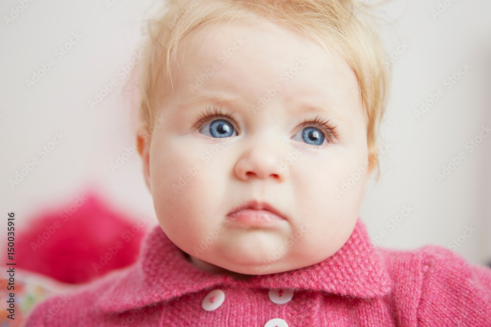 Portrait of baby girl, with bright blue eyes, close-up Portrait of baby girl, with bright blue eyes, close-up
