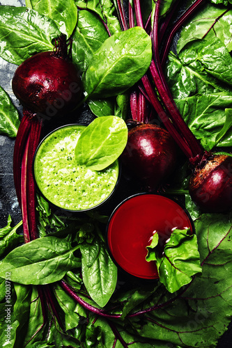 Healthy smoothies made of spinach and beets, fresh vegetables, food background, flat lay