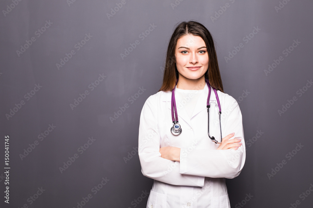 Portrait of young medical doctor on a grey background Portrait of young medical doctor on a grey background