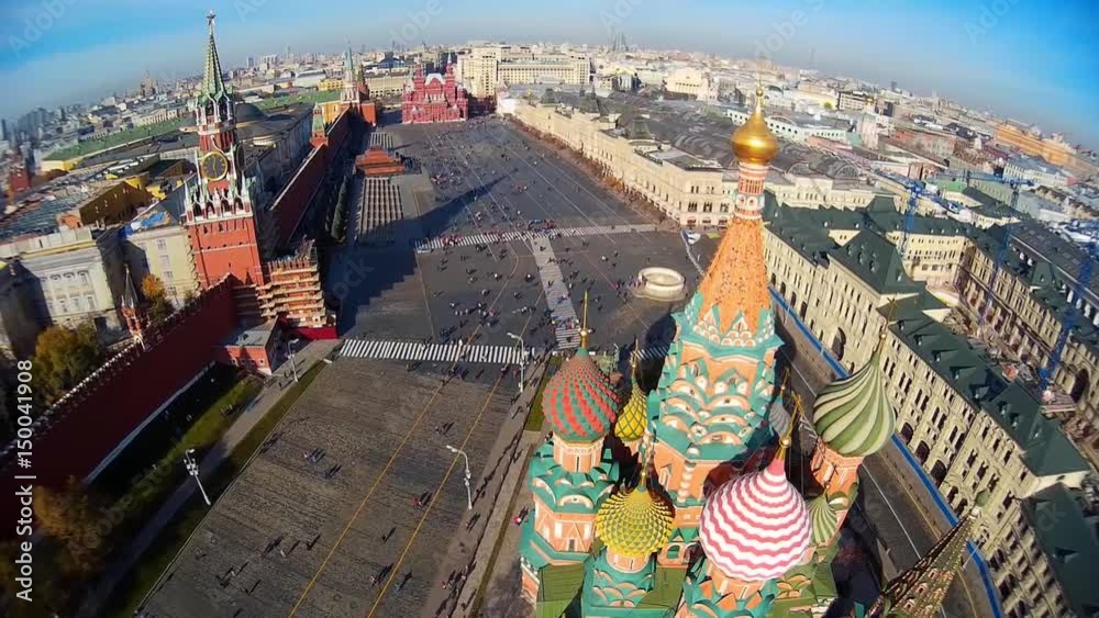 Saint Basil's Cathedral church in the Red Square museum UNESCO Moscow Russia  Pokrovsky. Central red square. Tourists walk. Decor of facades  Colored domes old architecture. Summer blue. Aerial above