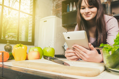 Beautiful woman looking at a tablet. photo