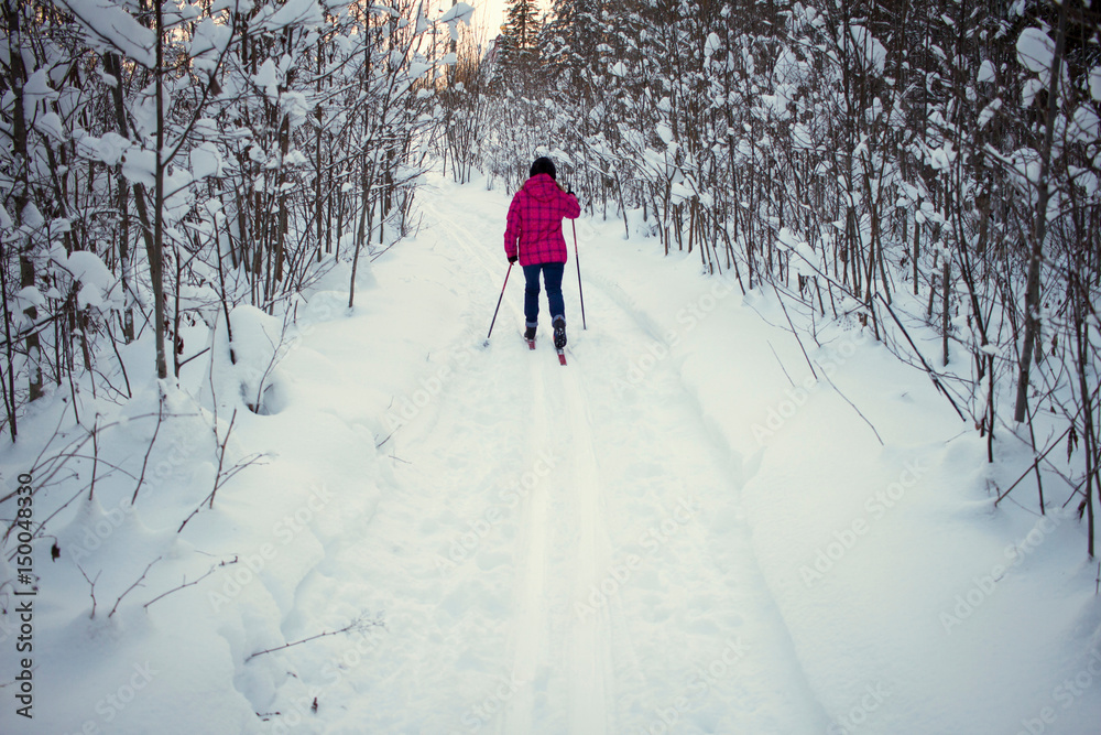 Teenage girl, cross country skiing, rear view, Chusovo, Russia Teenage girl, cross country skiing, rear view, Chusovo, Russia