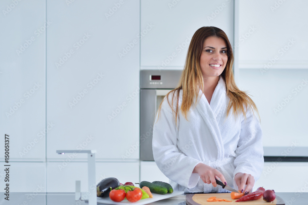 Beautiful smiling woman in kitchen