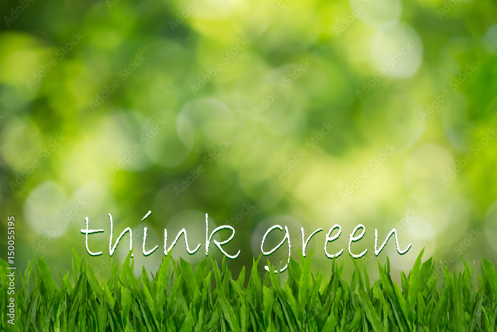 Text think green on green grass on blurred green bokeh background, environment concept