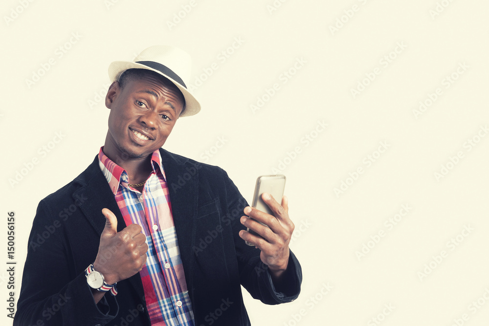 Young African American man taking picture with smartphone Young African American man taking picture with smartphone