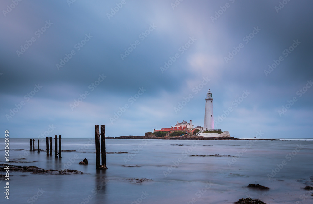 Wooden Pillars at St Mary's Lighthouse / St Mary's Lighthouse on a small rocky Island, just north of Whitley Bay on the North East coast. A causeway submerged at high tide links to the mainland