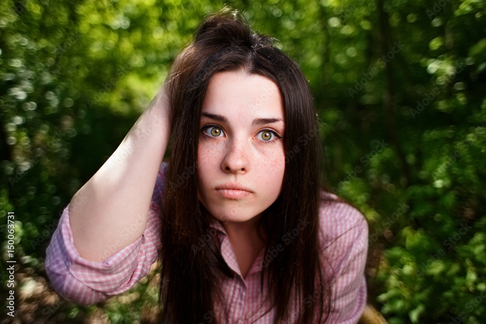 Portrait of attractive young pensive perplexed woman face close up Portrait of attractive young pensive perplexed woman face close up