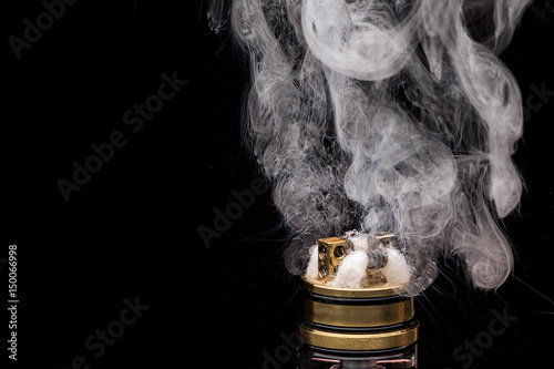  Burning of Electronic cigarette. Popular vaporizing e-cig gadget to vape glycerin e-liquid