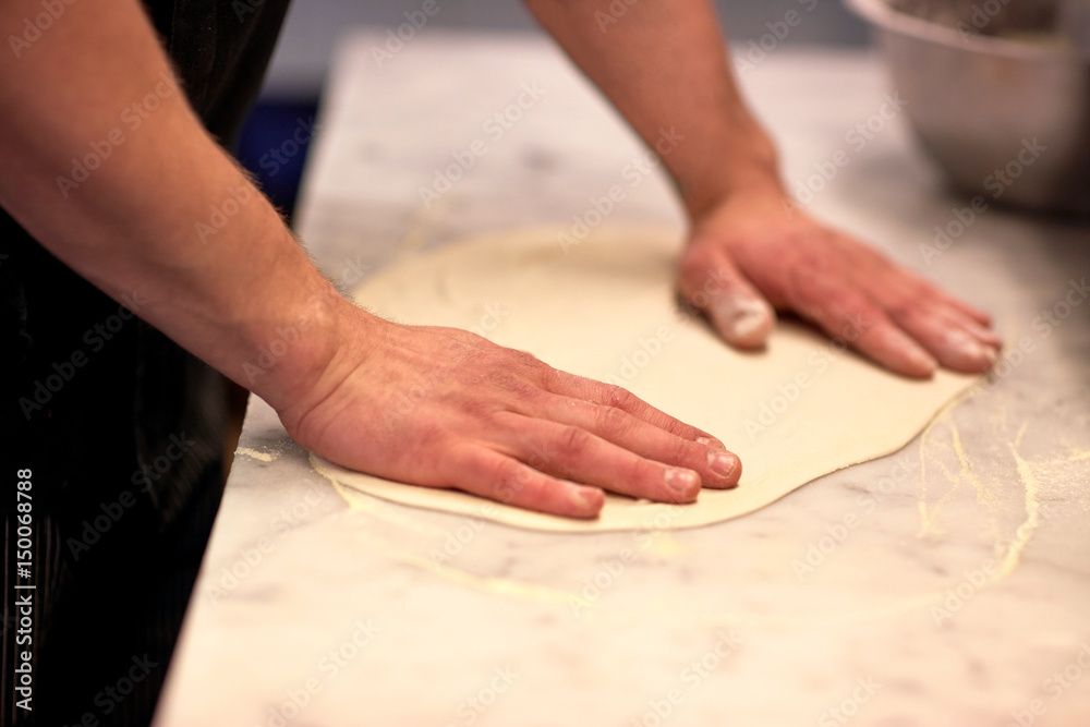 chef hands preparing dough on table at kitchen chef hands preparing dough on table at kitchen