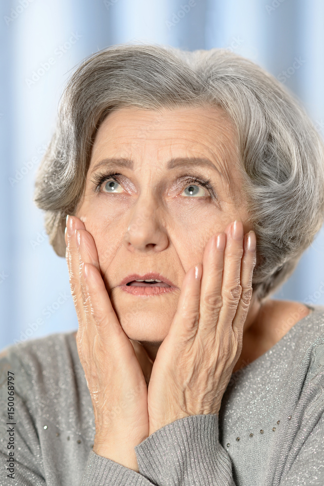 Beautiful sad elderly woman close-up Beautiful sad elderly woman close-up