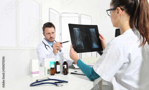 Doctors examining x-ray