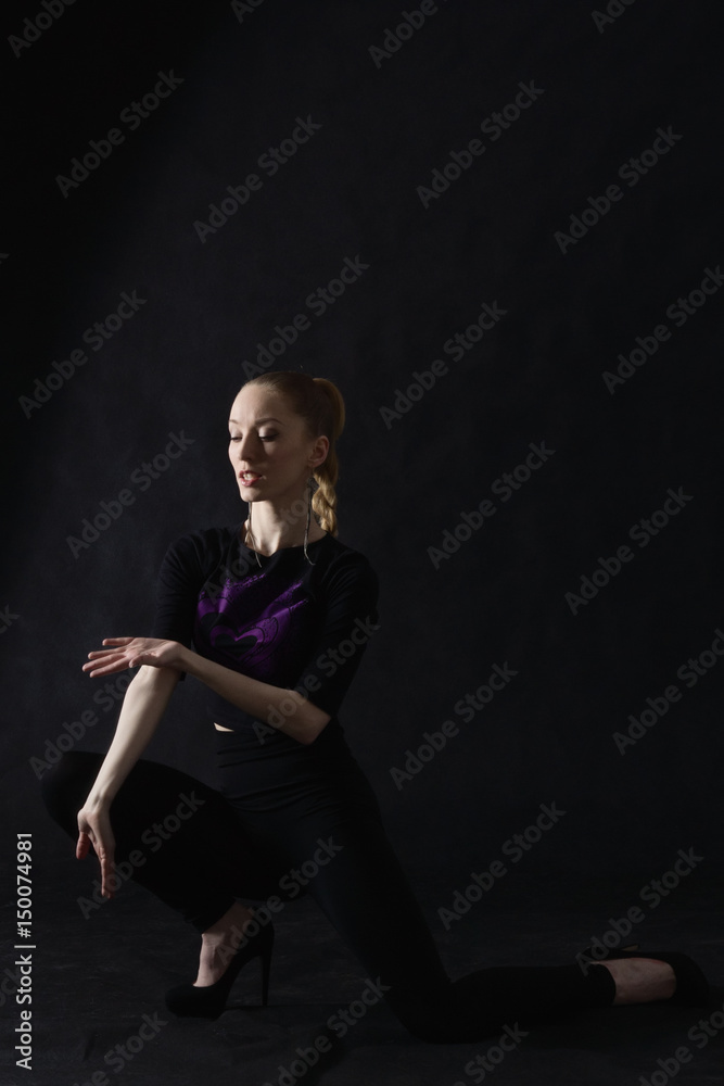 Vogue dancer posing on dark background Vogue dancer posing on dark background