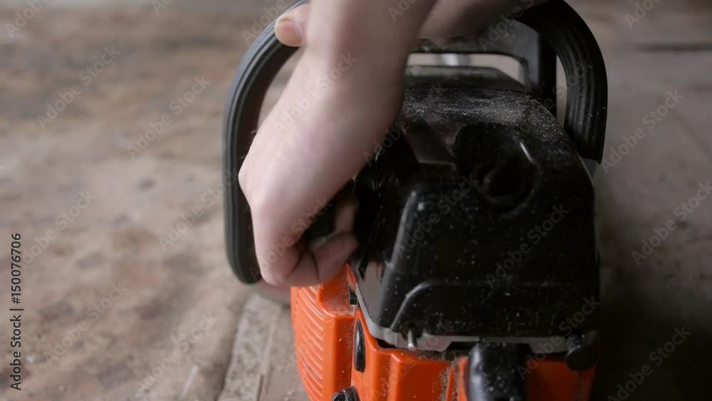 Man starts chainsaw
Man starts chainsaw