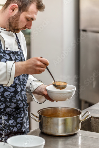 Chef is serving soup