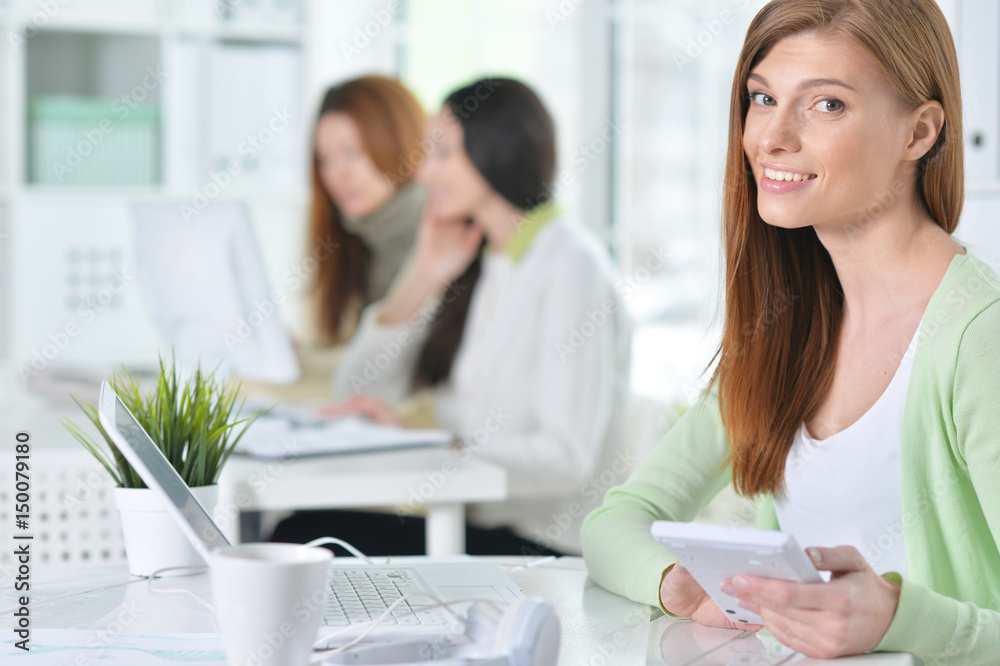 Portrait of a happy business woman using laptop Portrait of a happy business woman using laptop