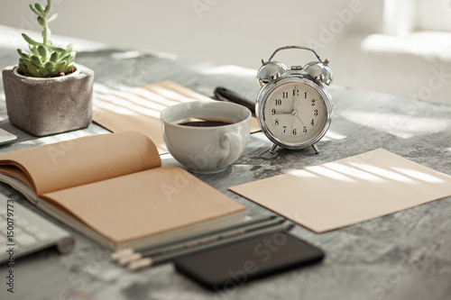 Office desk table with computer, supplies and phone