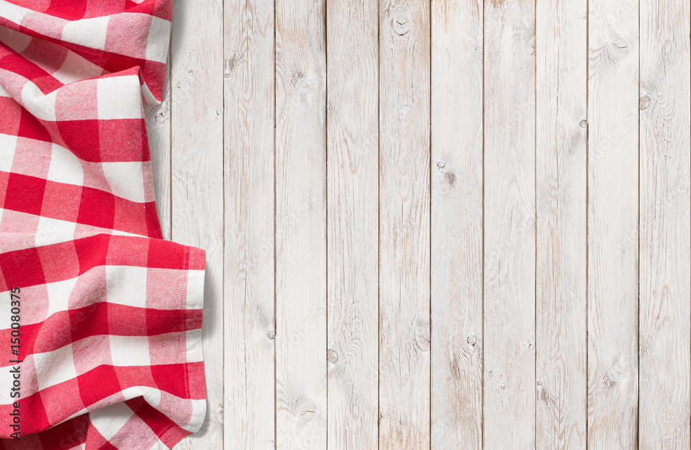 Naklejka premium red picnic cloth on white wood table