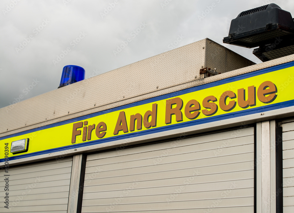 Sign on side of fire engine reading Fire And Rescue. Sign on side of fire engine reading Fire And Rescue.