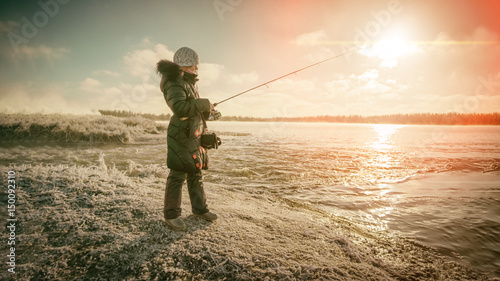 Girl on winter fishing.