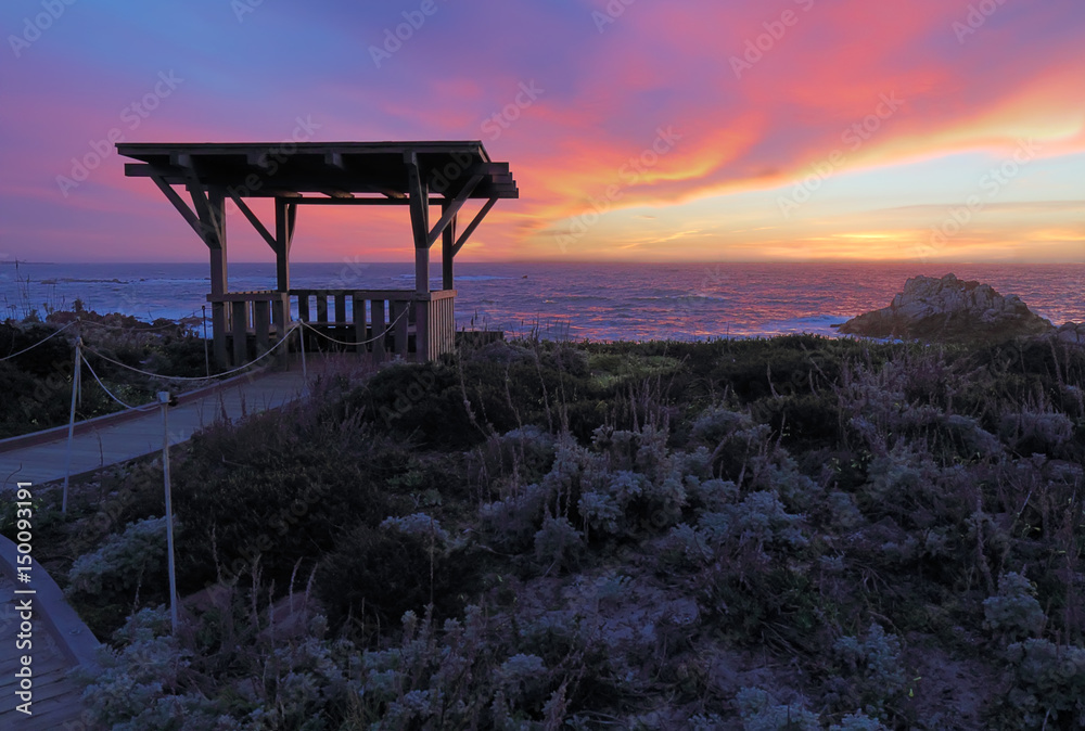 Sunset behind a public gazebo at Asilomar State Beach in California Sunset behind a public gazebo at Asilomar State Beach in California